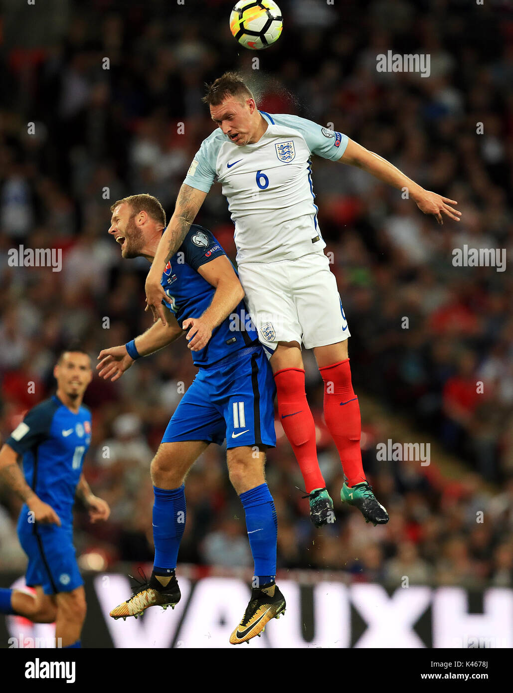 Slovakia's Adam Nemec (left) and England's Phil Jones battle for the ball during the 2018 FIFA World Cup Qualifying, Group F match at Wembley Stadium, London. Stock Photo