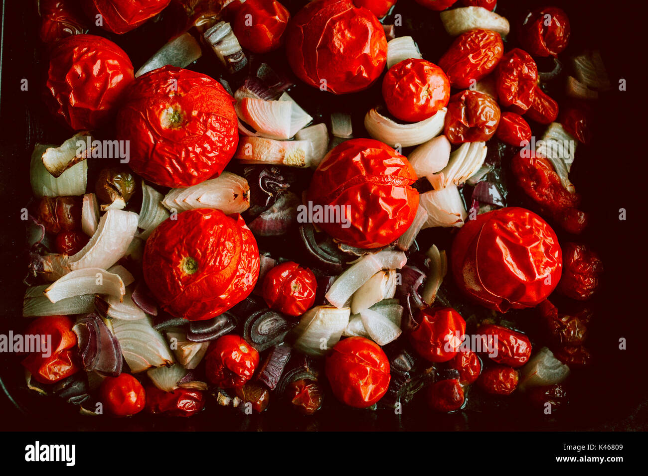 roasted tomatoes on a baking tray Stock Photo