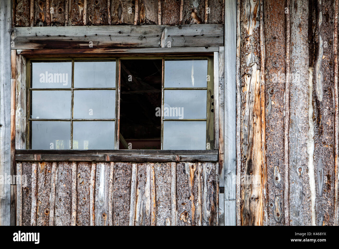 Rustic log sided cabin in the Yukon in Canada abandoned with a missing