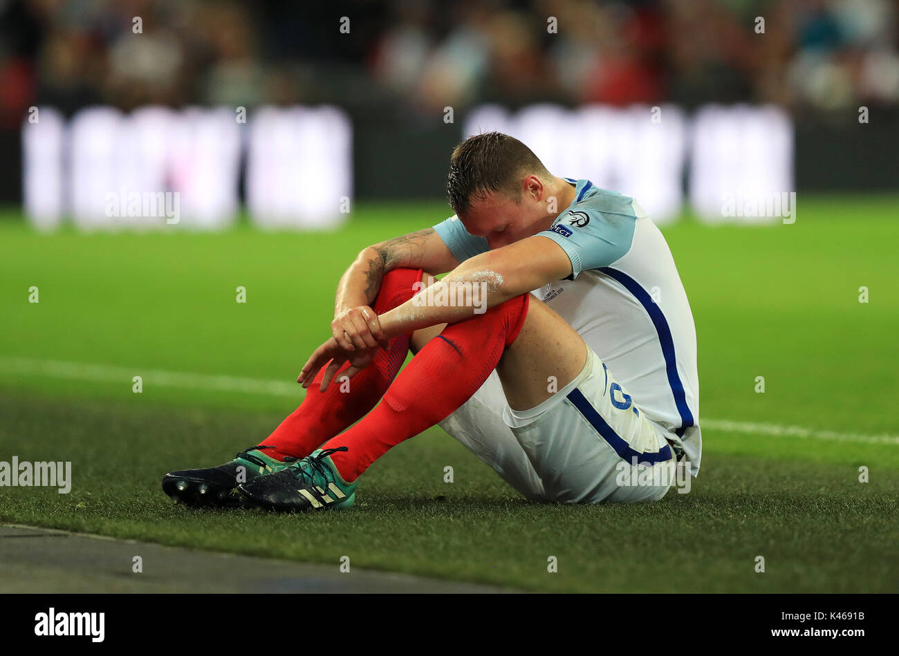 England's Phil Jones sits dejected during the 2018 FIFA World Cup Qualifying, Group F match at Wembley Stadium, London Stock Photo