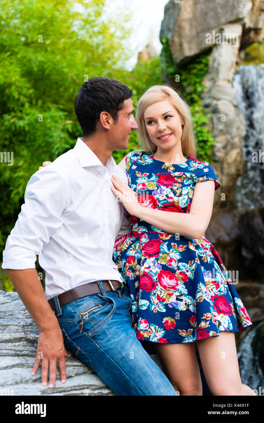 Man and woman embracing in summer park Stock Photo - Alamy