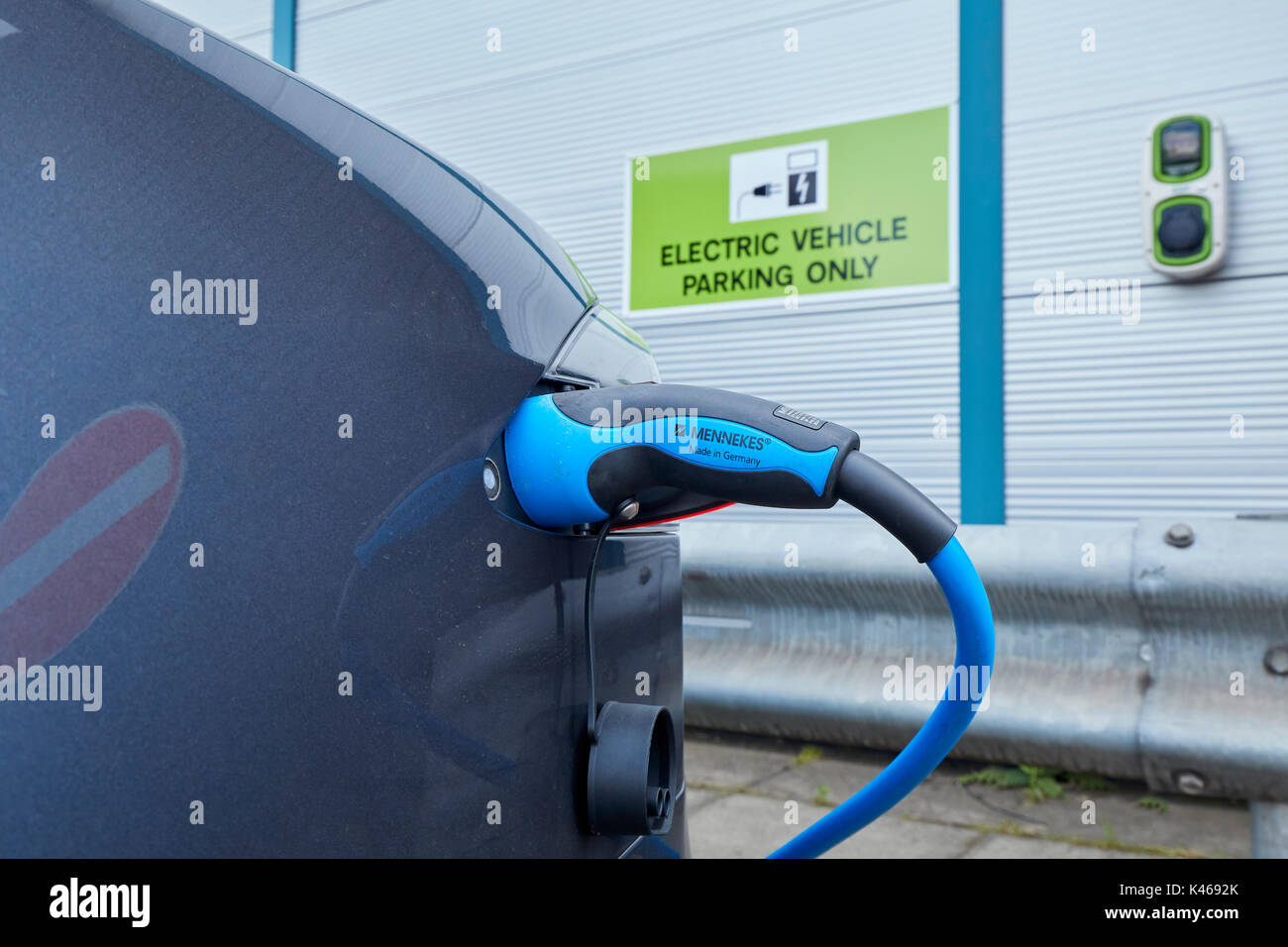 Tesla Car on Charge at Charging Station UK Stock Photo Alamy