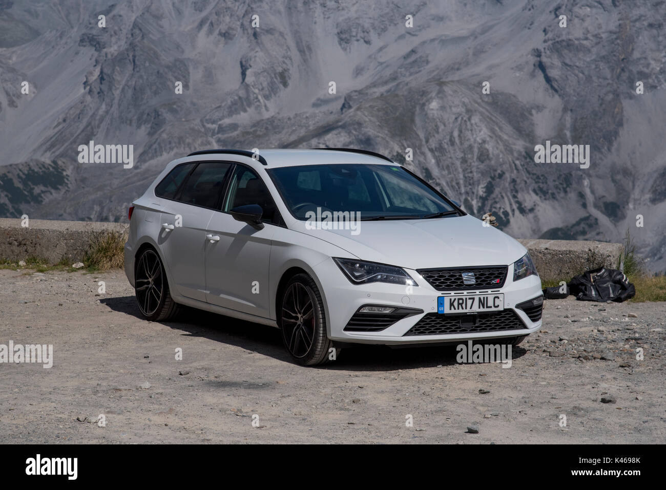 SEAT Cupra performance car parked at the top of the Stelvio Pass, one of the Alps Ultra High passes, from Italy into Switzerland Stock Photo