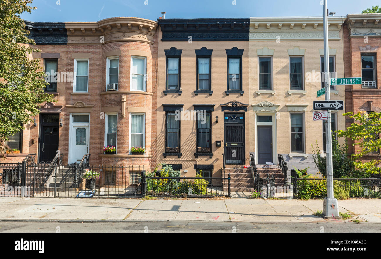 A row of brick apartment buildings on the corner of St. Johns and St. Francis Place in the Crown Heights Neighborhood of Brooklyn, New York Stock Photo