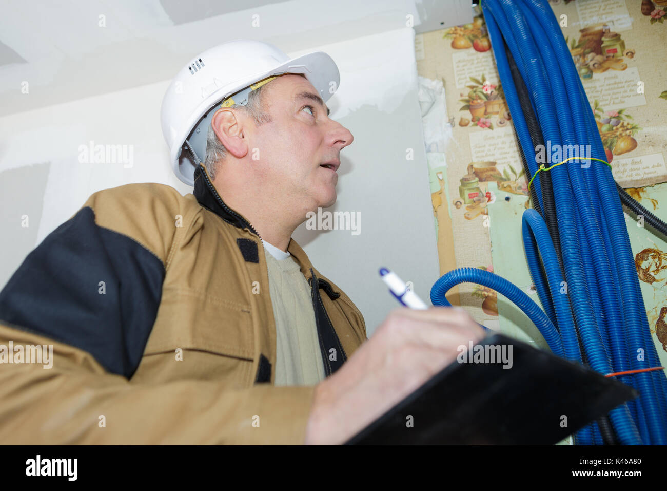 professional plumber checking the installation of water pipes Stock Photo