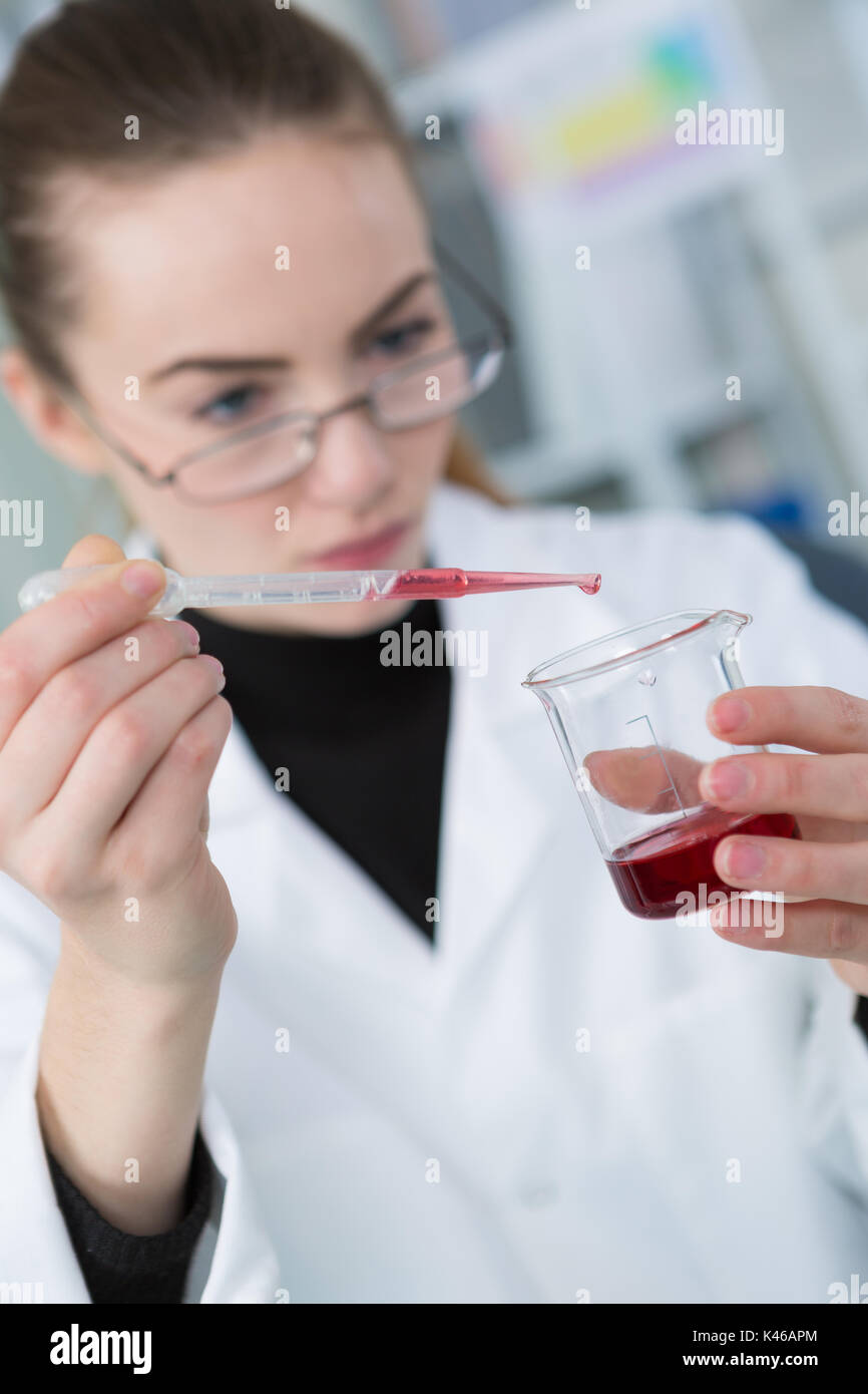 blood taken through pipette from test tube in laboratory Stock Photo