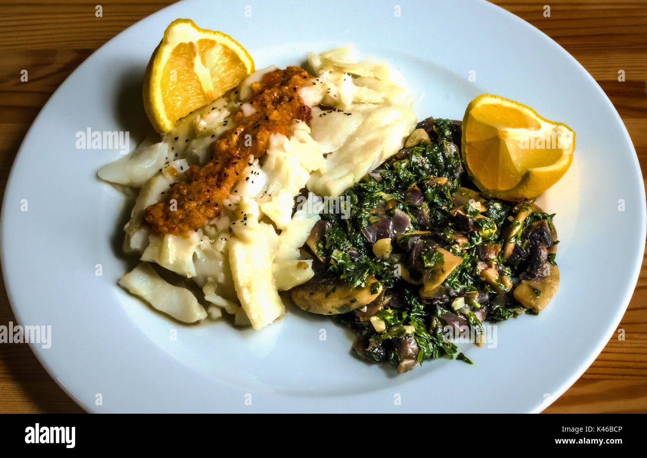Cod fish, poached with spinach, mushrooms, lemon, butter and a touch of