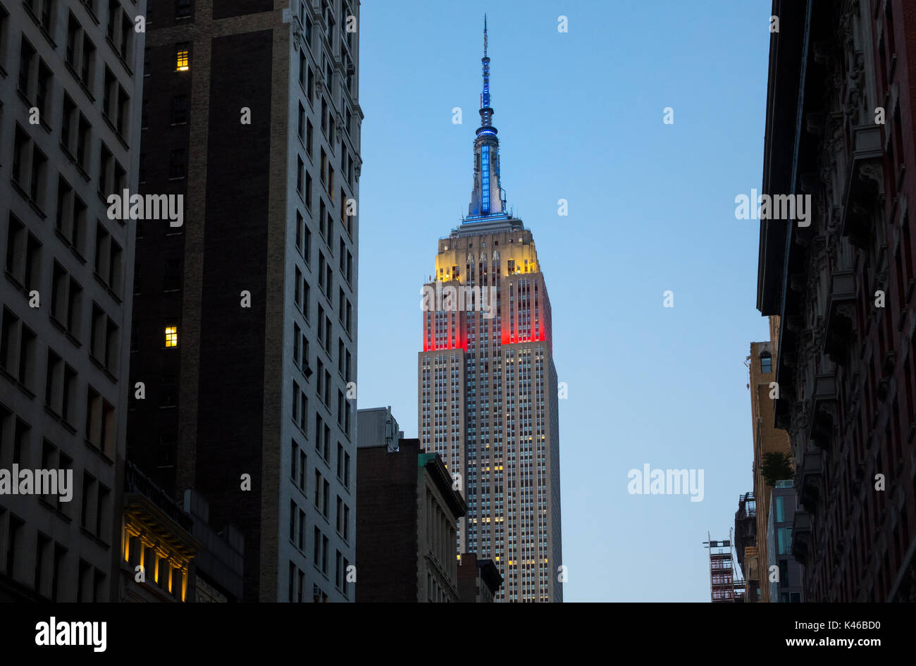 Empire State Building At Night Showing The Colors Of The American