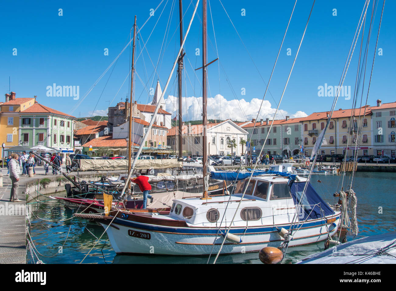 Izola, Slovenia, April 17, 2017: 44MP large panorama of Izola old fishing harbor with traditional fishing boats and old medieval town centre in backgr Stock Photo