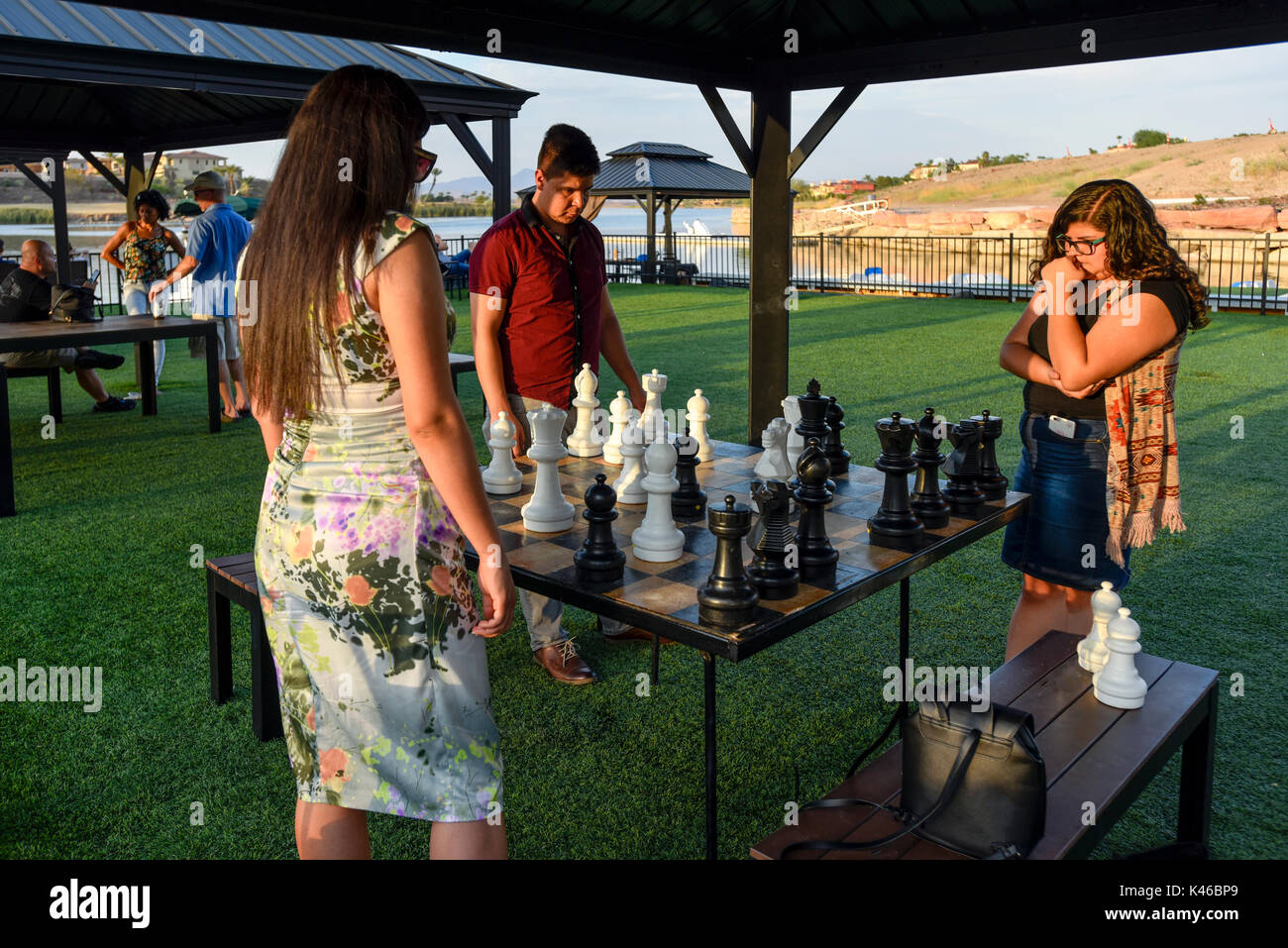 young people concentrating on an outdoor game of chess at Lake Las Vegas, Nevada Stock Photo