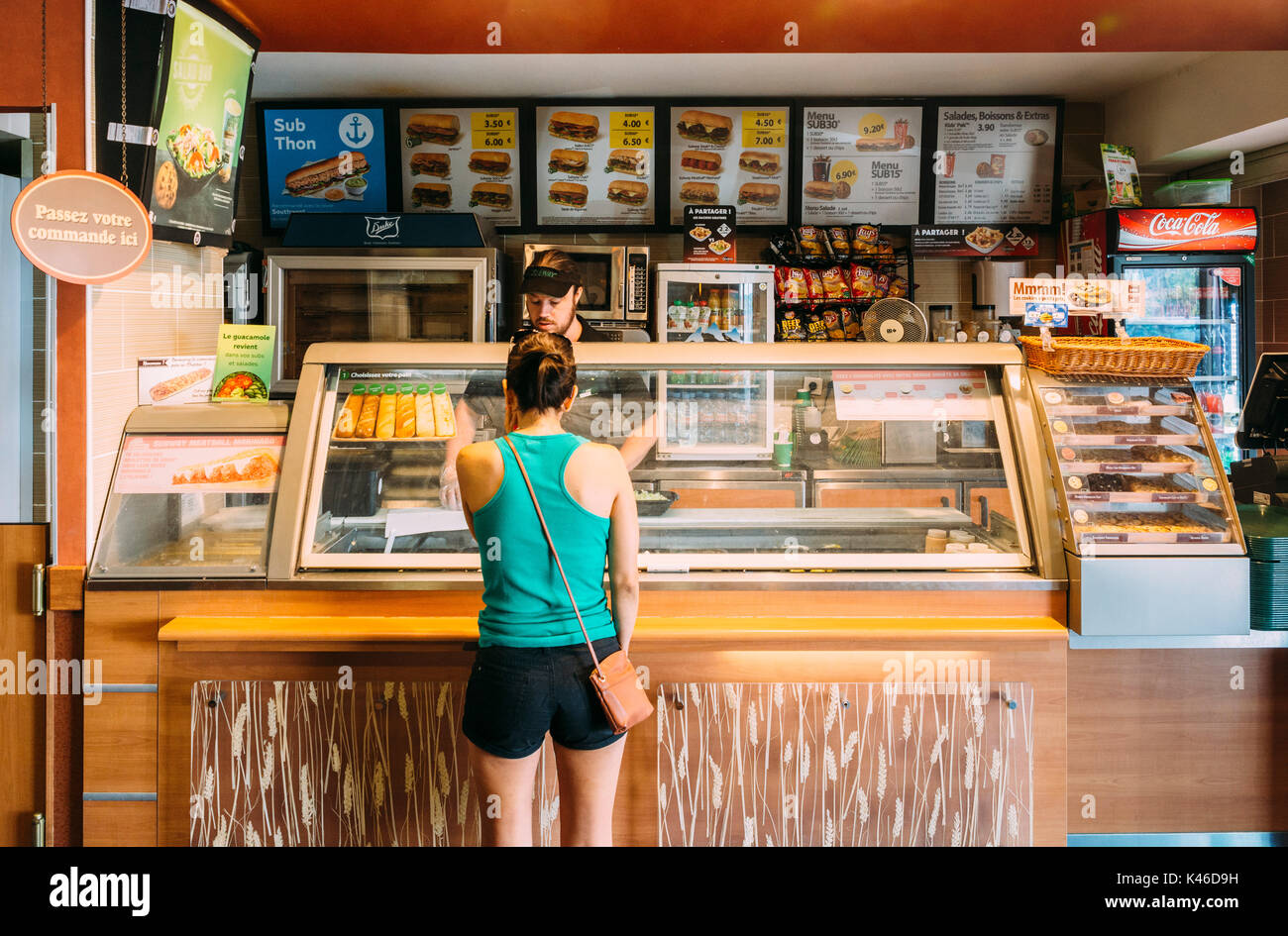 Subway fast-food restaurant in France. Customer at the counter. Subway is supposed to be an alternative healthy fast-food chain Stock Photo