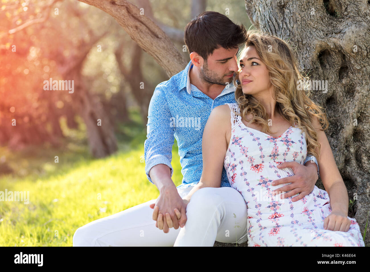 Beautiful couple in love on a walk in autumn forest Stock Photo - Alamy