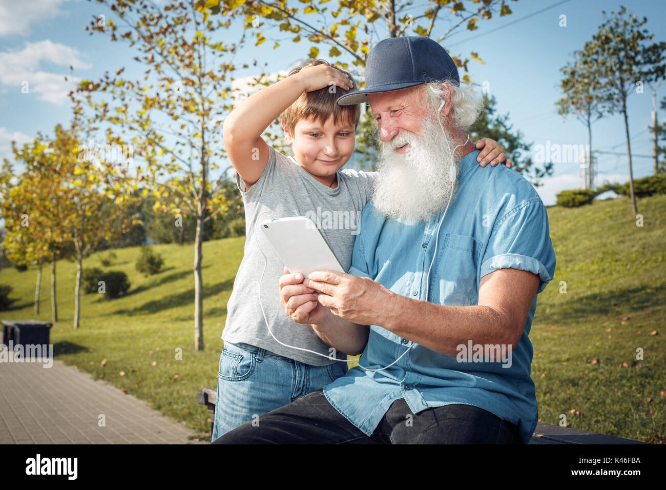 grandfather and grandson with tablet Stock Photo