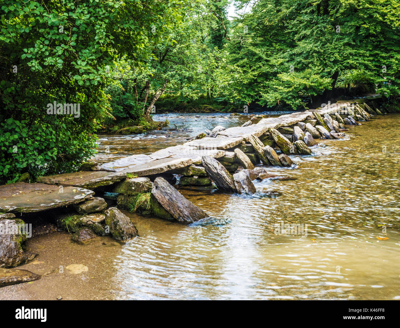 Tarr Steps, the famous 17-span medival clapper bridge across the River Barle in Exmoor, Somerset. Stock Photo