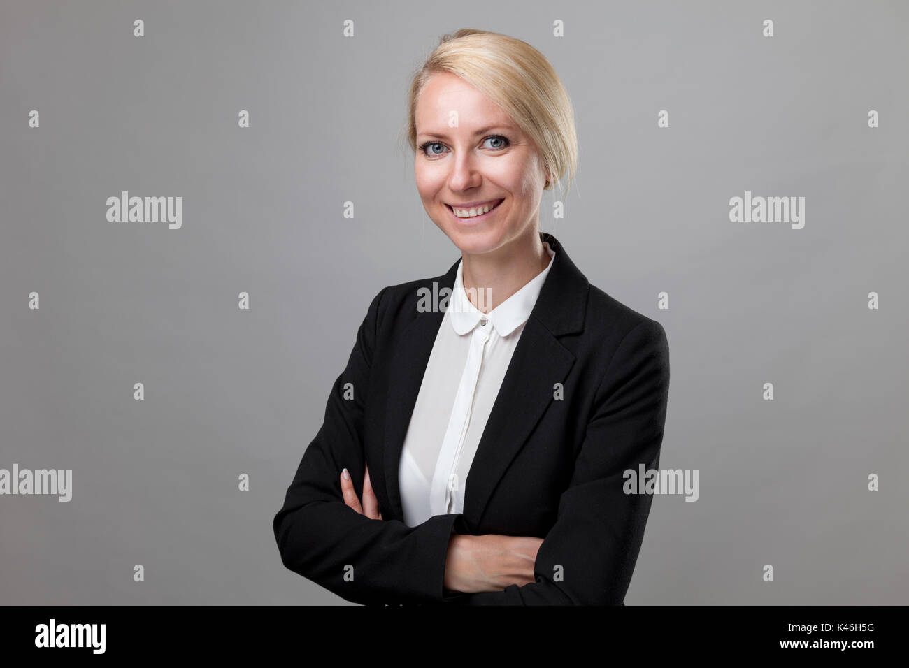 Young and happy business woman in suit Stock Photo - Alamy