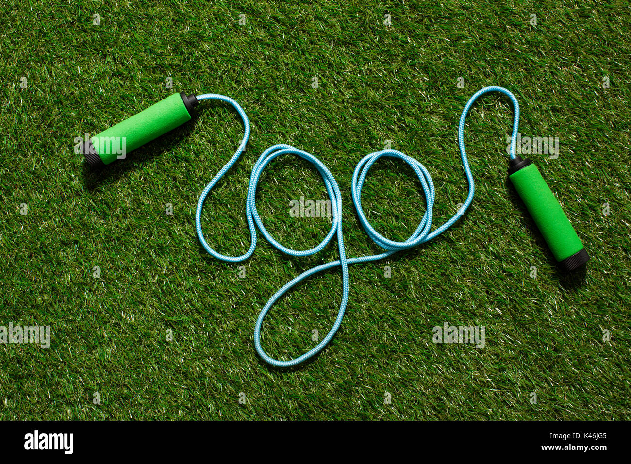 top view of skipping rope on the grass in form of word go Stock Photo