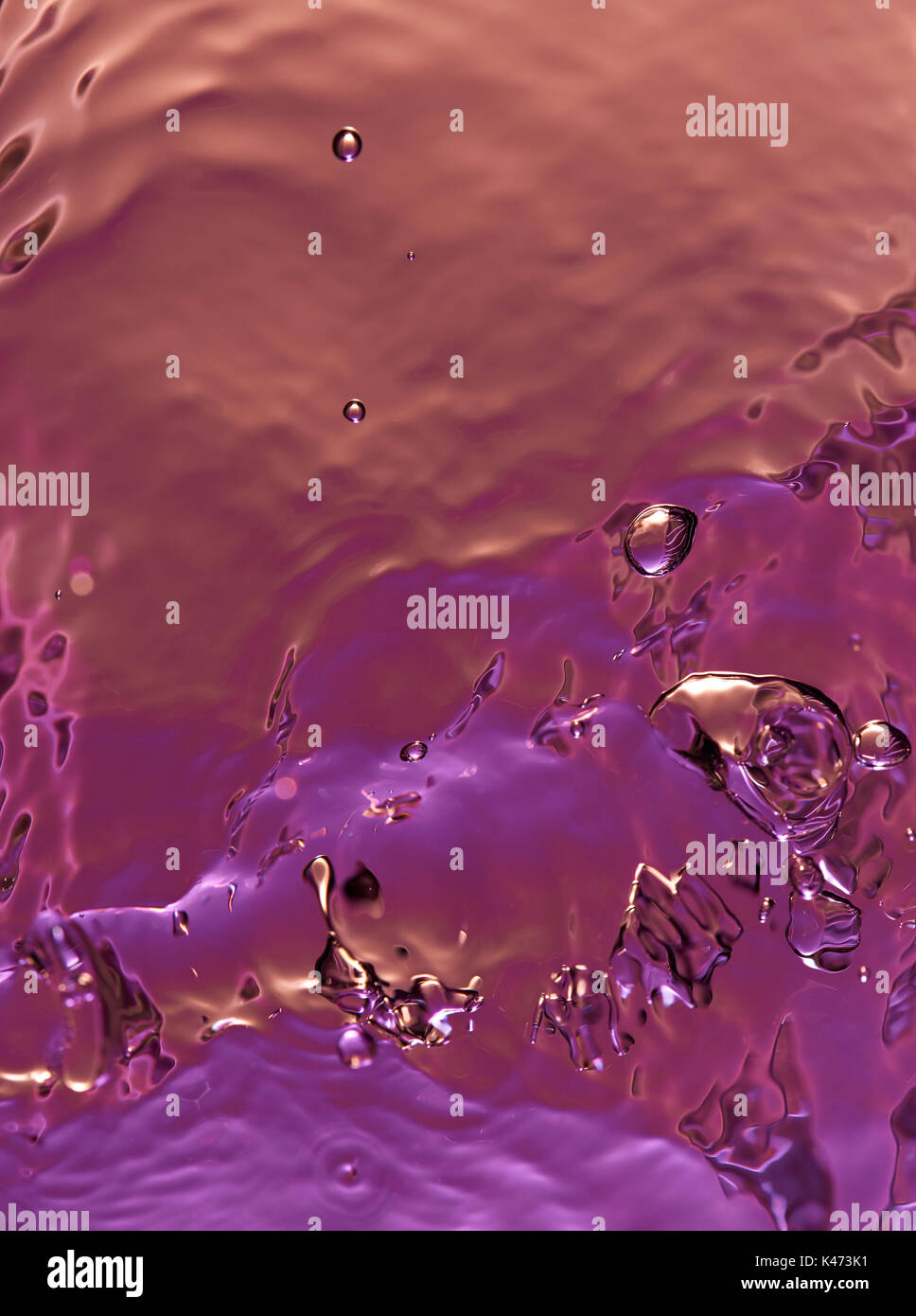 Purple color abstract water texture closeup. Liquid gradient color surface Stock Photo