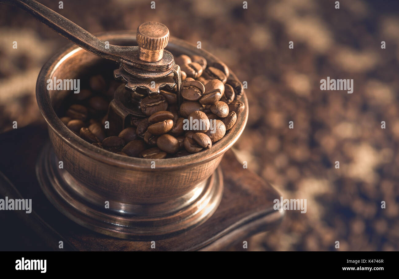 Roasted coffee beans in the coffee grinder Stock Photo Alamy