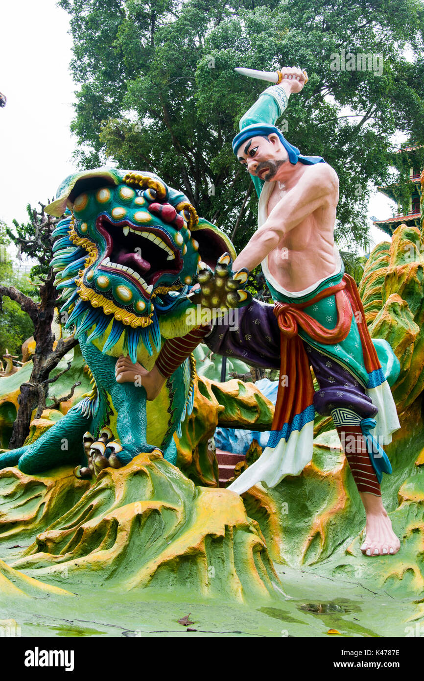 Diorama depicting a legendary warrior as he slays a dragon, at the Haw Par Villa (Tiger Balm Gardens), Pasir Panjang, Singapore Stock Photo