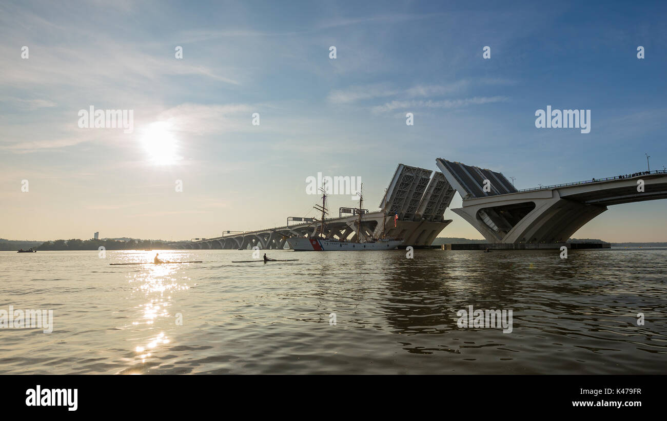 The United States Coast Guard Cutter Eagle arrives under the Woodrow Wilson drawbridge on the Potomac River early in the morning Stock Photo