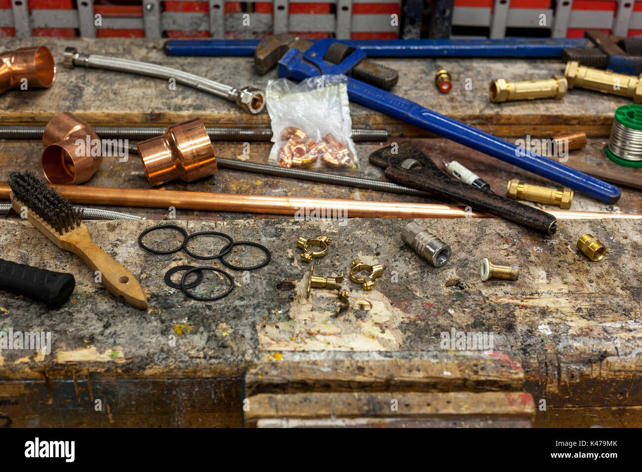 Very well used looking plumbing tools with copper pipe and