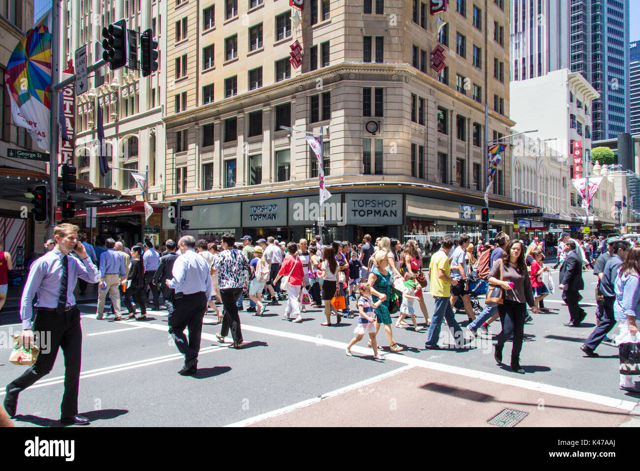 Pedestrians crossing George street on a sunny day, Sydney, NSW, New South Wales, Australia Stock Photo