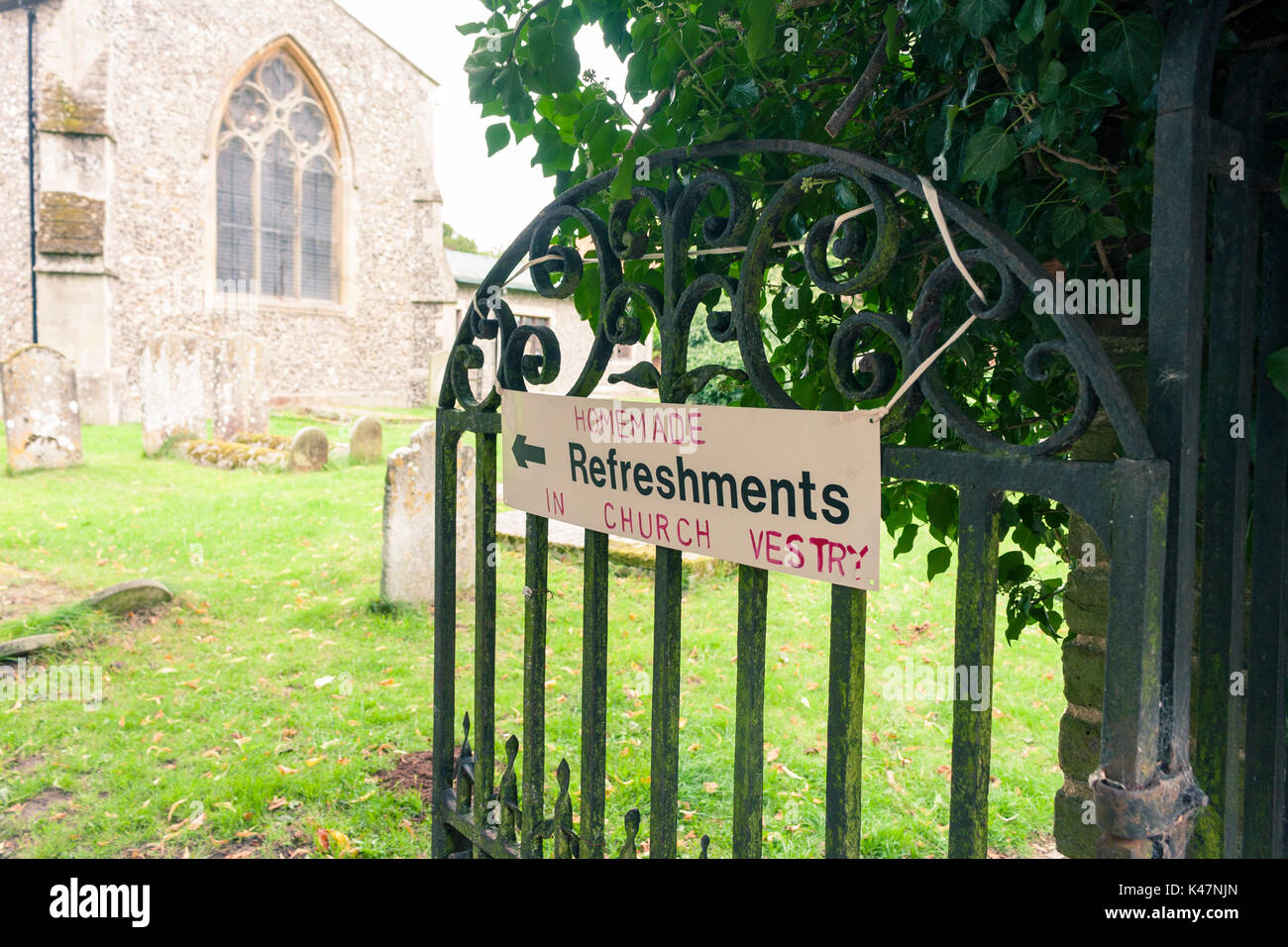 A handmade sign for refreshments on the gate of a local church Stock Photo