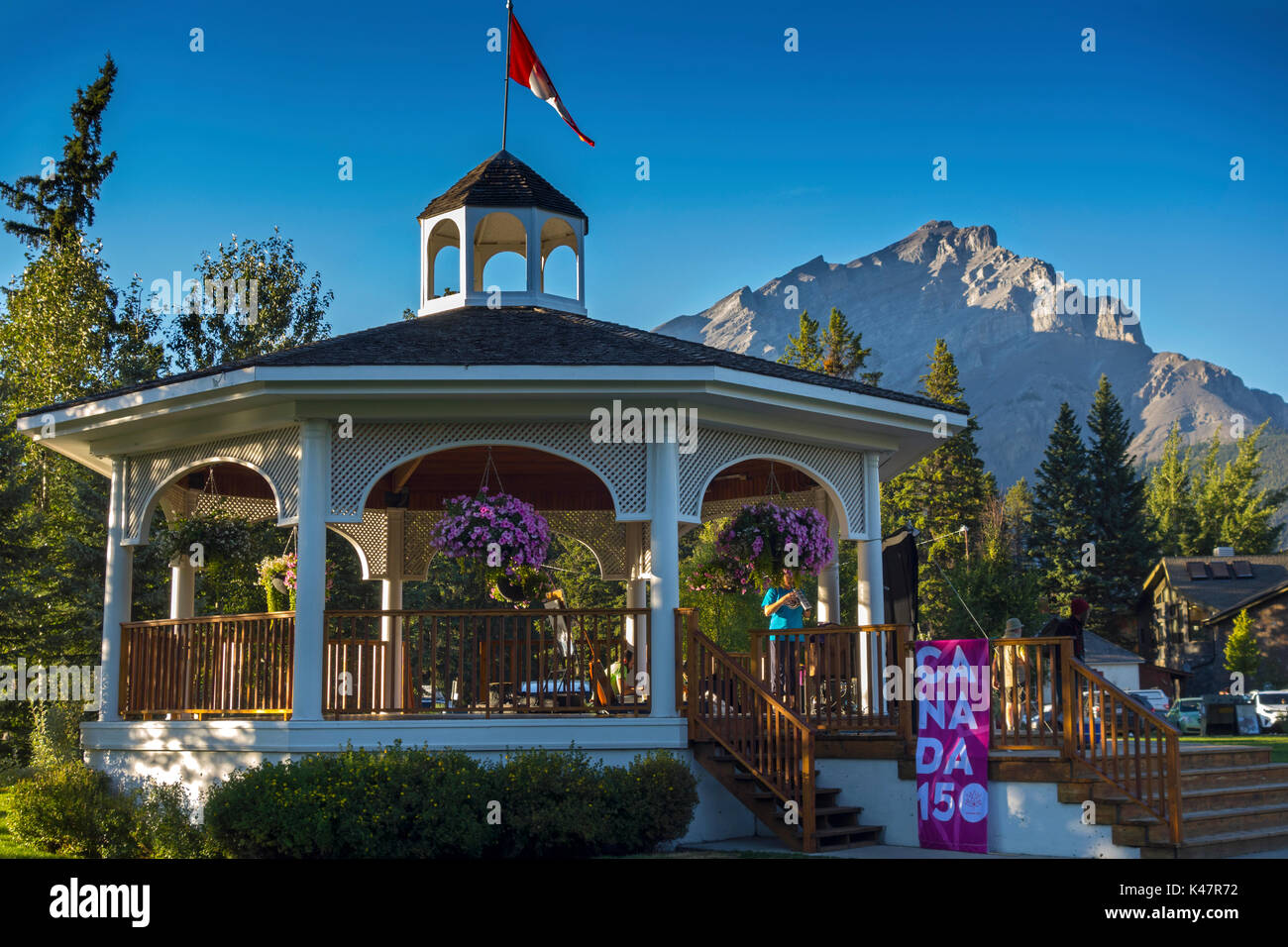 Outdoor Urban Park hosting Canada 150 Celebrations in Town of Banff, Birthplace of Canadian National Parks. Cascade Mountain in the Background Stock Photo