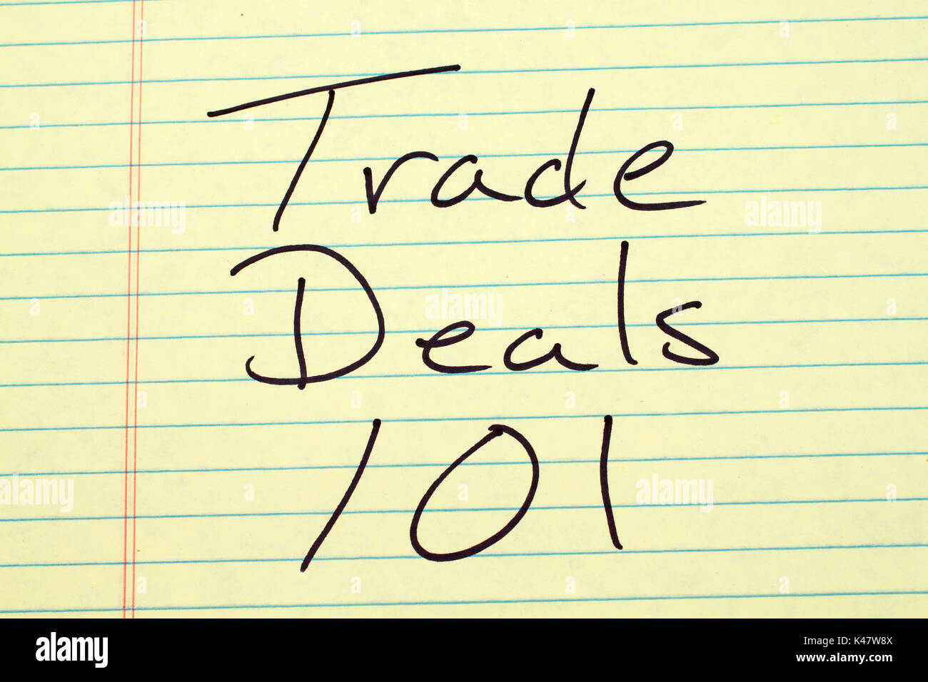 The words 'Trade Deals 101' on a yellow legal pad Stock Photo