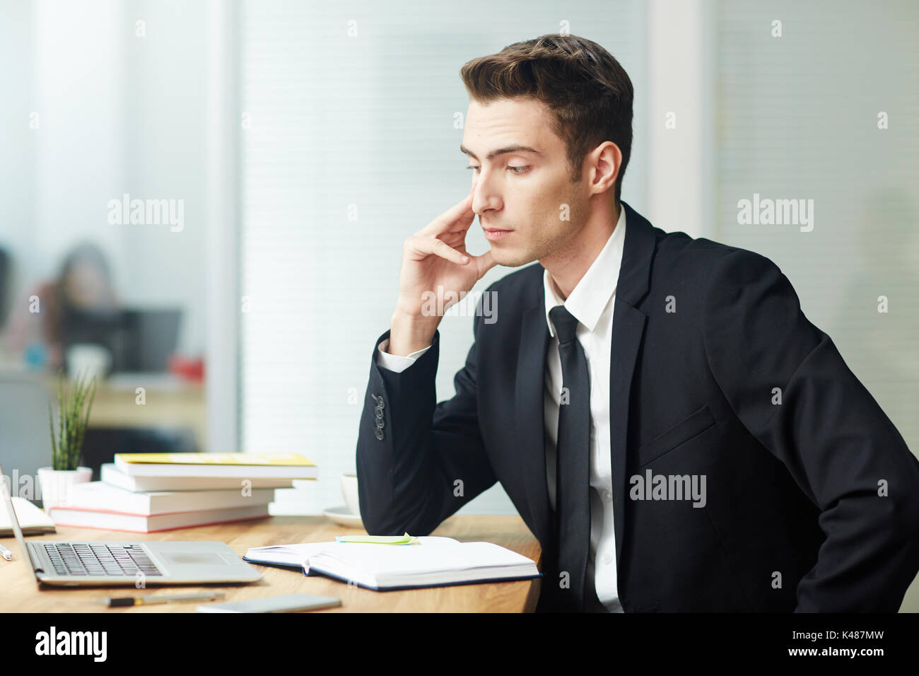 Analyst at workplace Stock Photo