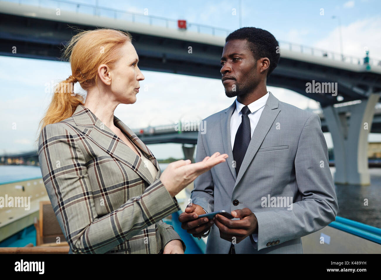 Talk of business partners Stock Photo - Alamy
