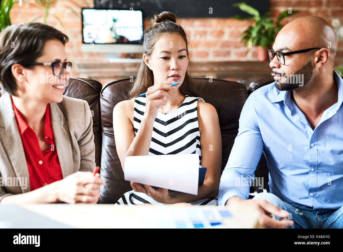 Sharing Creative Ideas with Coworkers Stock Photo - Alamy