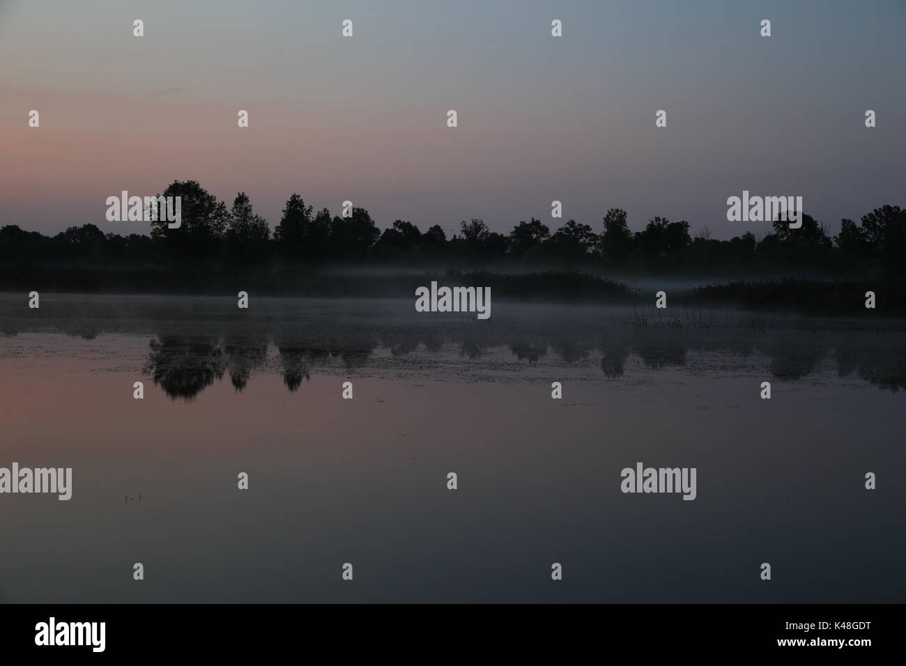 Komoka Ponds sunrise reflection Stock Photo - Alamy