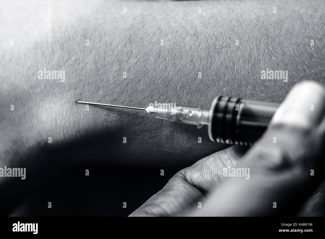 A hand taking a painkiller injection Stock Photo Alamy