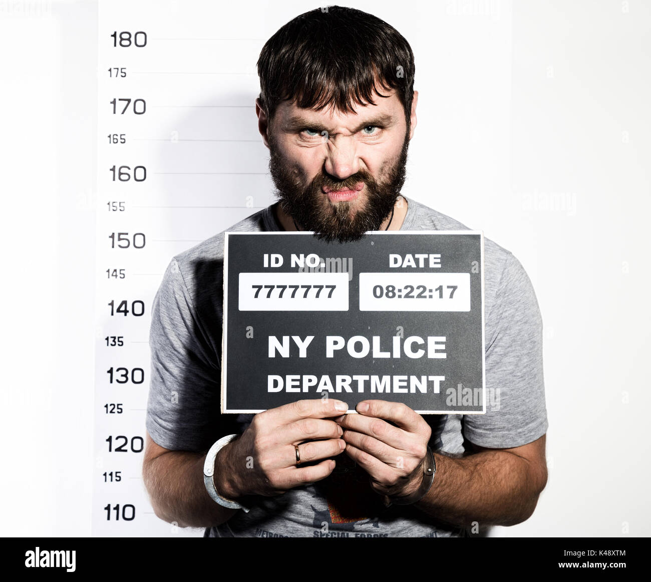 IMAGE(https://c8.alamy.com/comp/K48XTM/bearded-man-in-handcuffs-holds-a-sign-criminal-mug-shots-K48XTM.jpg)