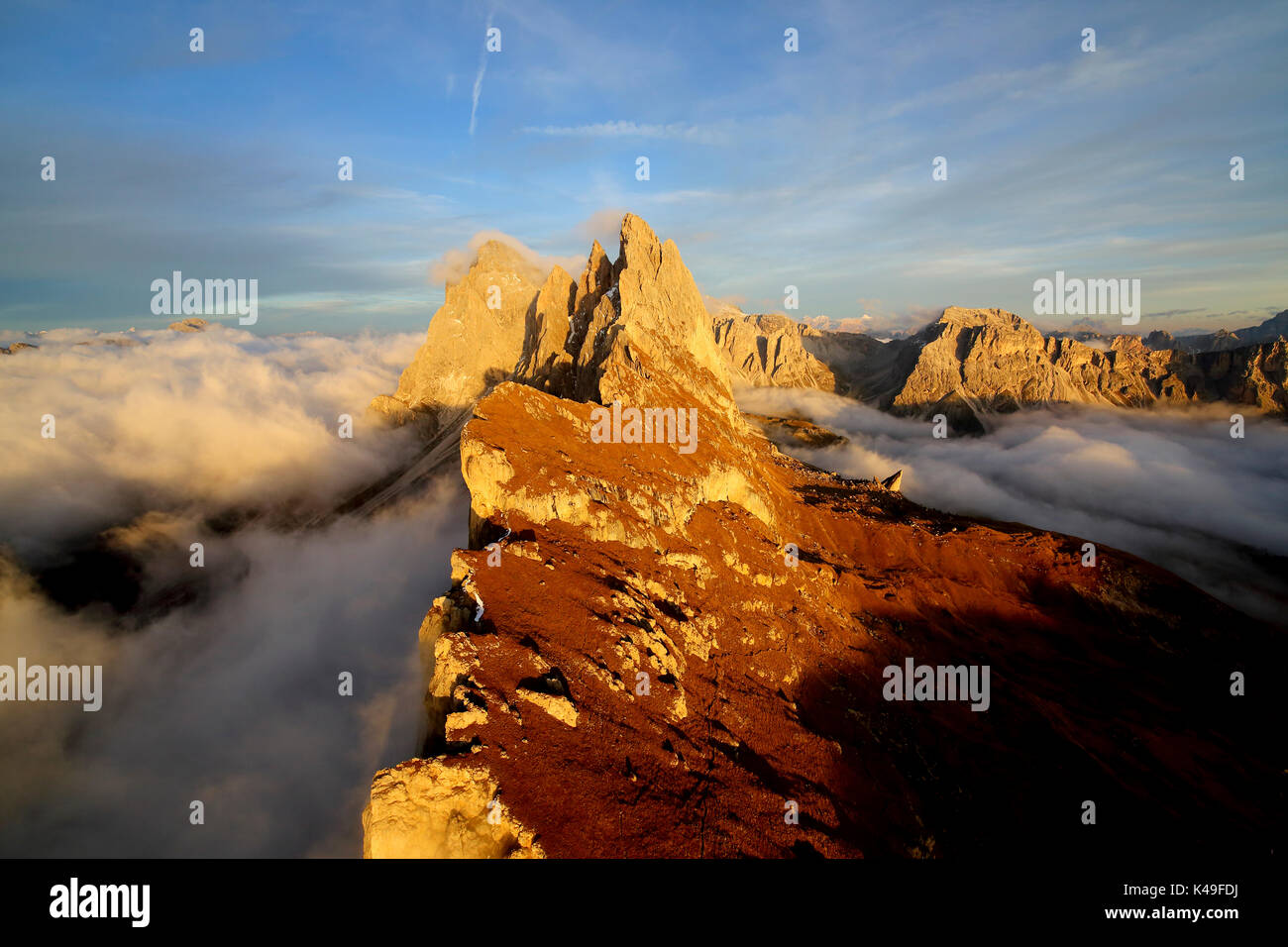 Aerial shot from Seceda of Odle surrounded by clouds at sunset. Dolomites Val Funes Trentino Alto Adige South Tyrol Italy Europe Stock Photo