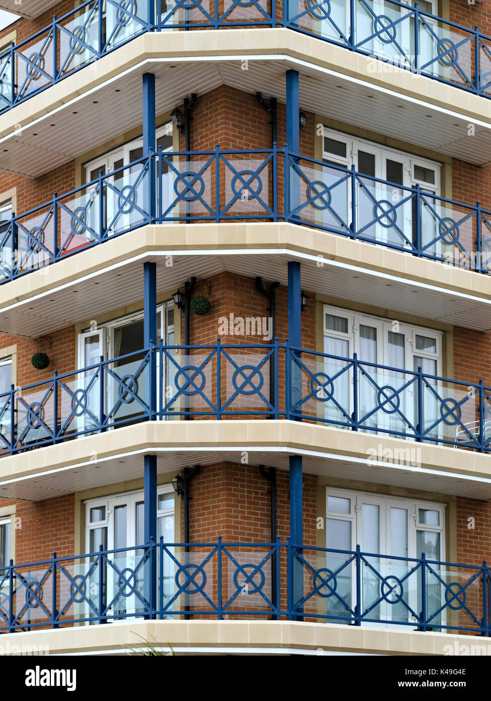 Modern flats and apartments with blue painted metal railings and