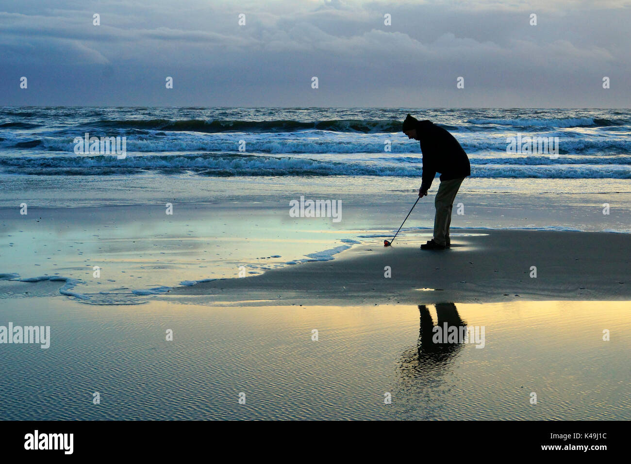 Golfer On The Beach Stock Photo