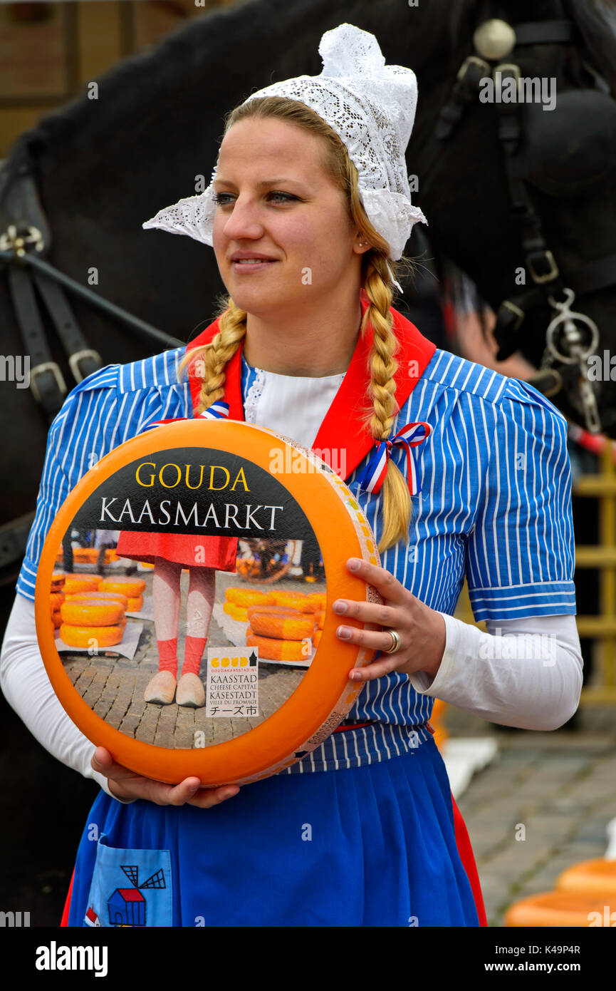 Dutch Cheese Girl With A Gouda Cheese Truckle, Cheese Market Gouda, Netherlands Stock Photo