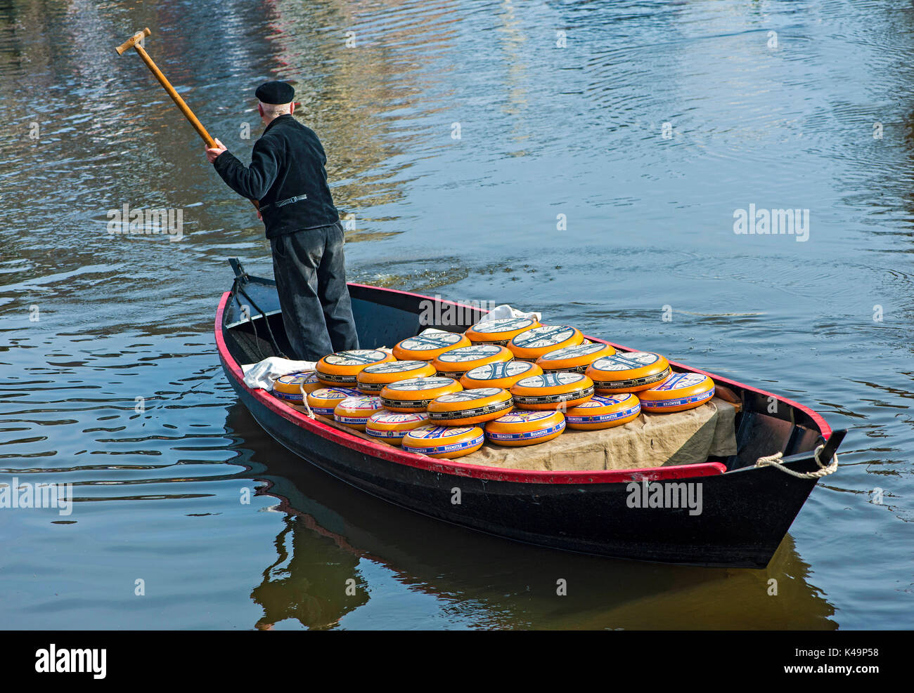Transport Of Beemster Cheese In A Boat With Coxswain On A Canal, Alkmaar, Netherlands Stock Photo