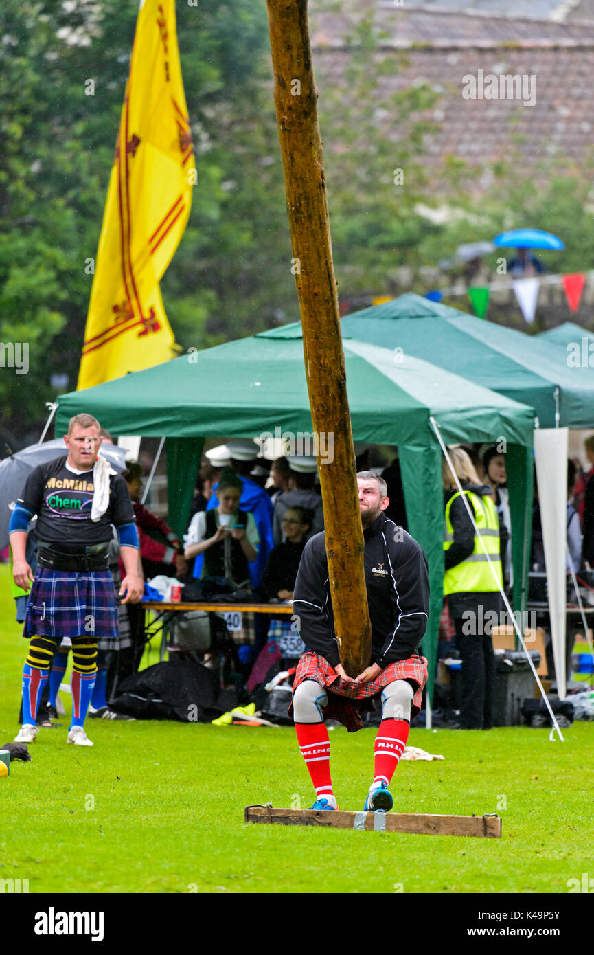 Participant In The Caber Tossing Competition, Ceres Highland Games, Ceres, Scotland, United Kingdom Stock Photo