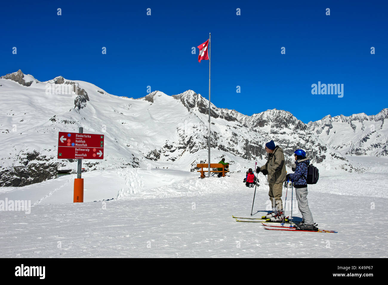 Skiers At The Viewpoint Moosfluh In The Aletsch Glacier Region, Riederalp, Valais, Switzerland Stock Photo