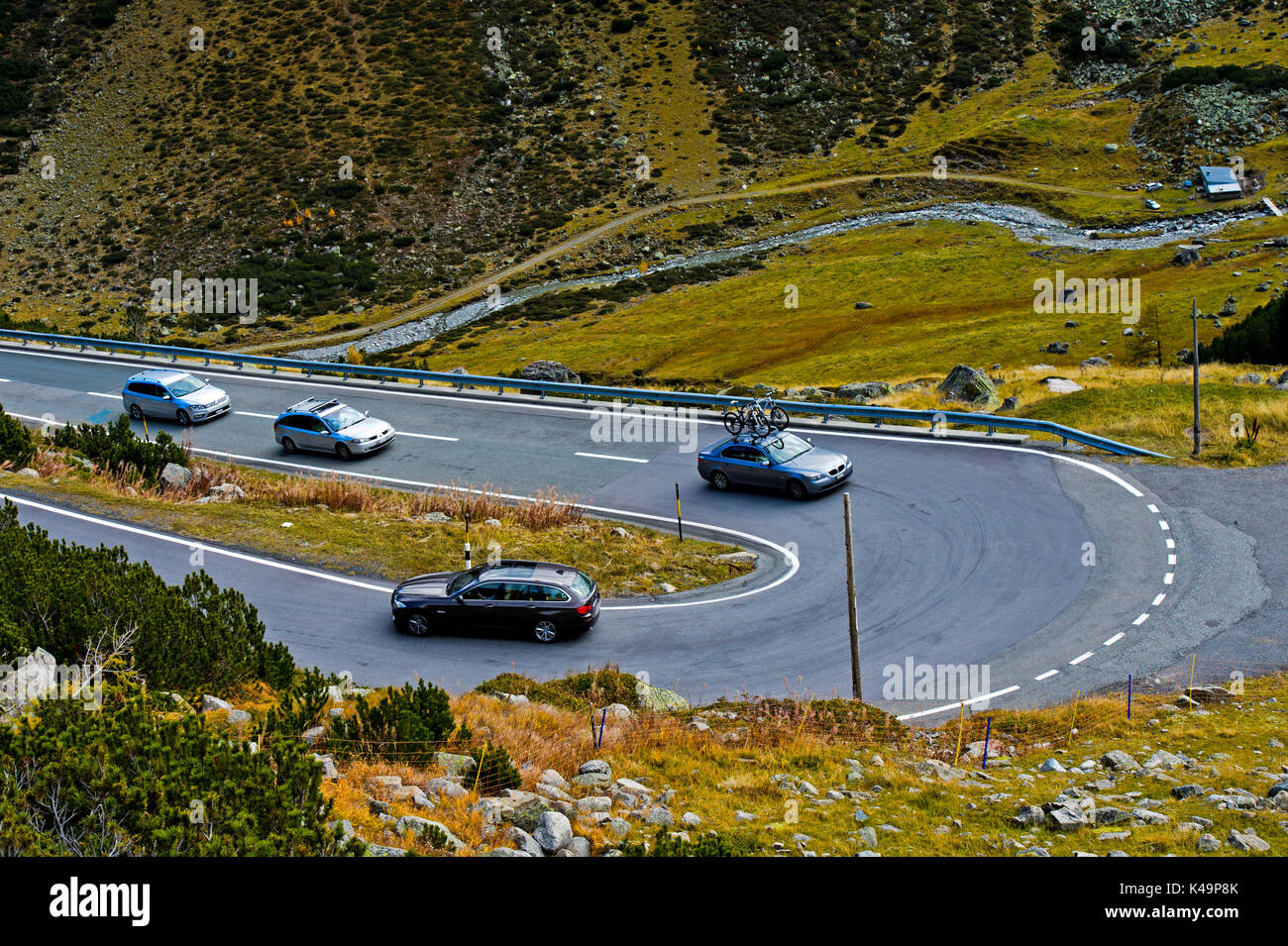 Cars On A Pass Road In A Hairpin Turn On The Flüela Pass Road, Davos, Graubunden, Switzerland Stock Photo