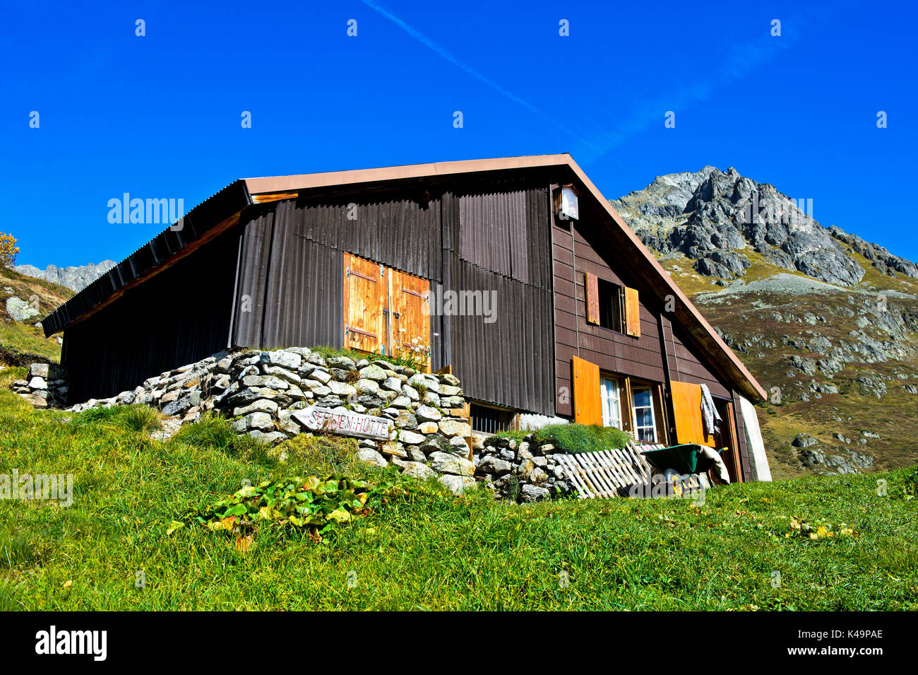 House Of A Farmer In The Mountains, Uri Alps, Canton Of Bern, Switzerland Stock Photo