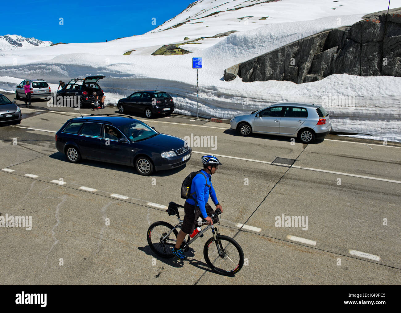 Road Traffic On The Highest Point Of The St Gotthard Pass, Airolo, Canton Of Ticino, Switzerland Stock Photo