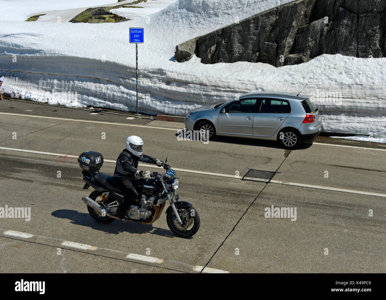 Road Traffic Goign Across The Highest Point Of The St Gotthard Pass, Airolo, Canton Of Ticino, Switzerland Stock Photo