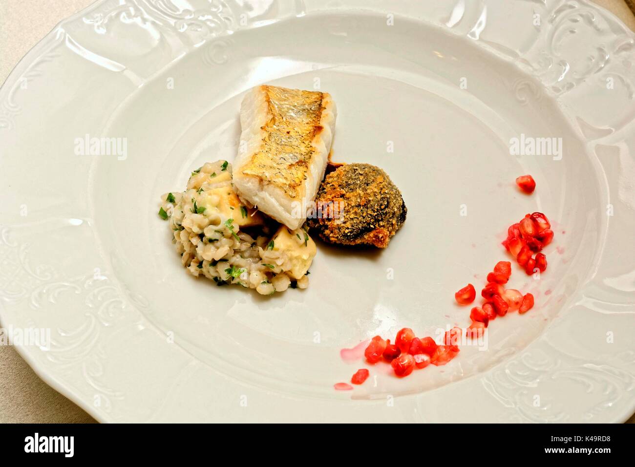 Fine Dining, With Fogas Quittengraupen Risotto, Pomegranate And Black Pudding Stock Photo