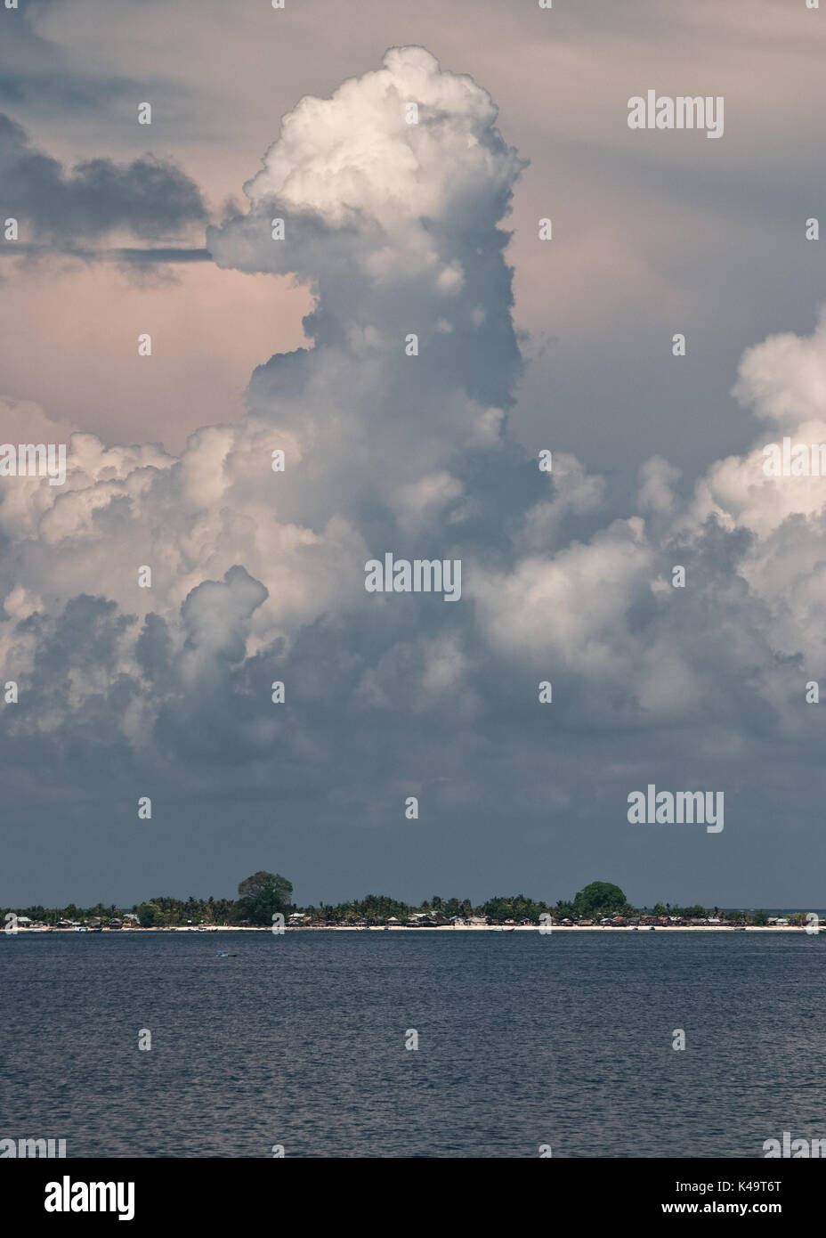 Towering Cumulus Clouds over Tropical Island in Indonesia Stock Photo