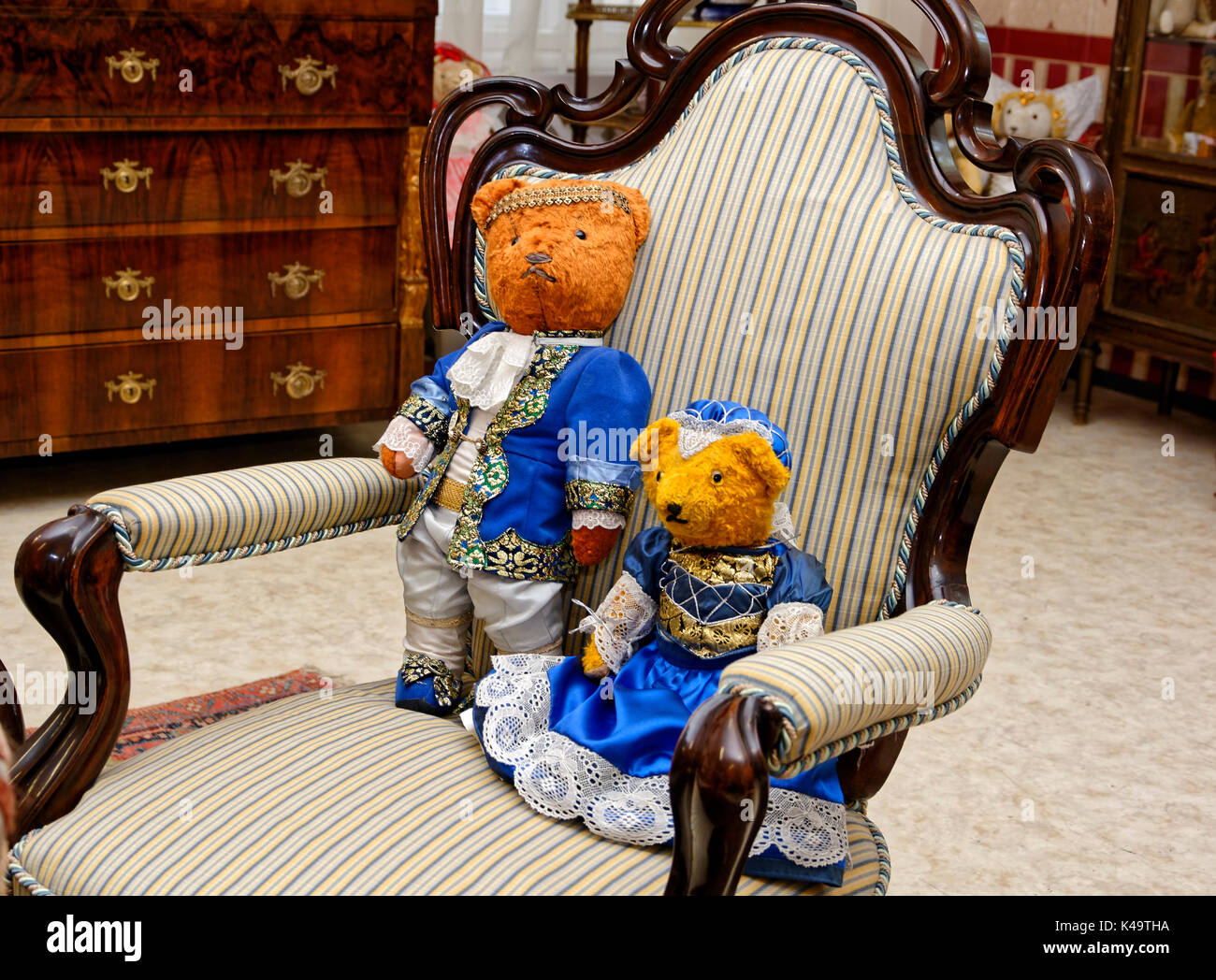 Teddy Bear Couple In Costume On An Upholstered Chair Stock Photo