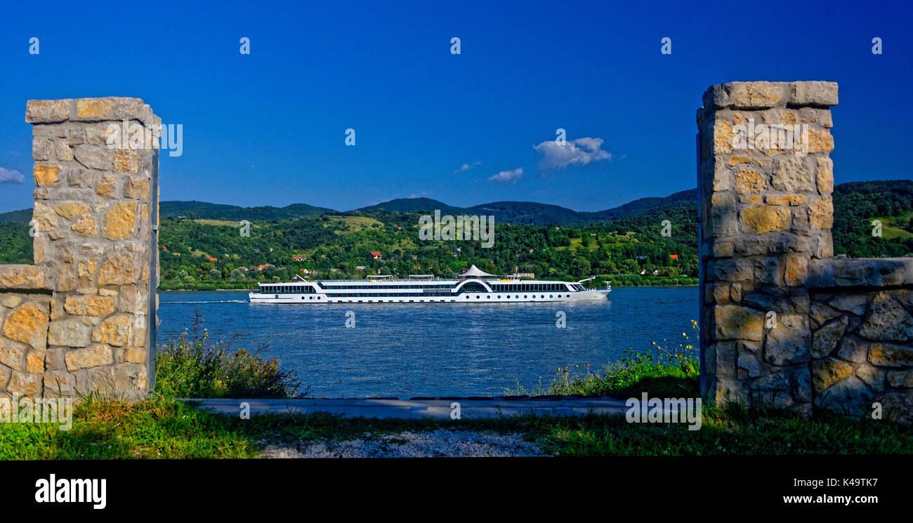 Cruise Ship Between Two Stone Pillars On The Danube In The Danube Knee Stock Photo